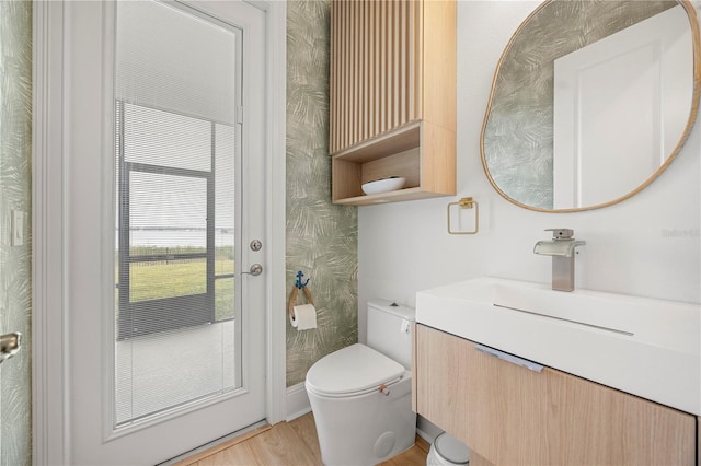 16689 Broadwater Ave, Winter Garden, FL 34787 - half bathroom with wood finished floors, vanity, and toilet