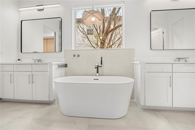 16689 Broadwater Ave, Winter Garden, FL 34787 - full bathroom with a freestanding bath and two vanities
