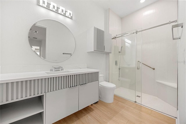 16689 Broadwater Ave, Winter Garden, FL 34787 - full bathroom featuring toilet, vanity, wood finished floors, and a stall shower