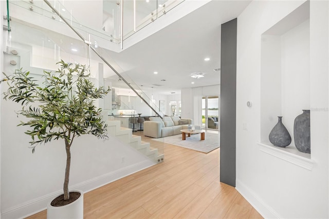 16689 Broadwater Ave, Winter Garden, FL 34787 - foyer entrance featuring light wood-type flooring, stairs, and recessed lighting