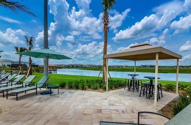 view of patio with a water view