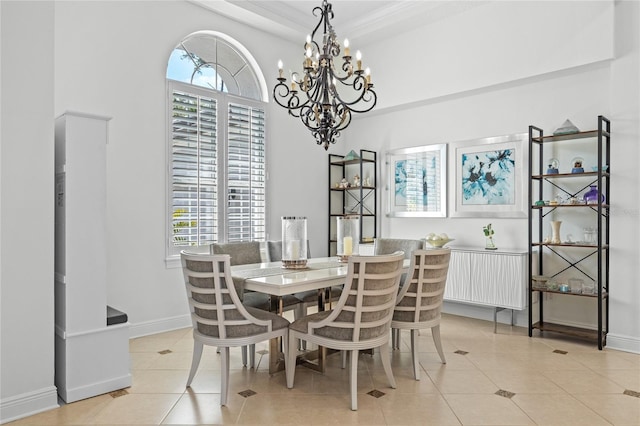 dining area featuring an inviting chandelier, baseboards, light tile patterned floors, and plenty of natural light