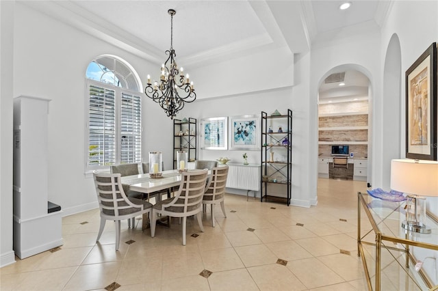 dining area with baseboards, radiator, ornamental molding, light tile patterned flooring, and arched walkways