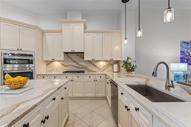 kitchen featuring hanging light fixtures, a sink, stainless steel double oven, gas cooktop, and dishwasher