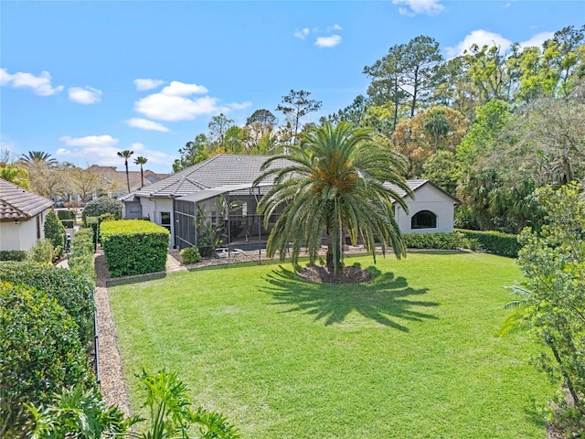 exterior space featuring a yard and a lanai