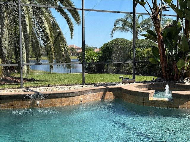 view of pool with fence, a lawn, a fenced in pool, and glass enclosure