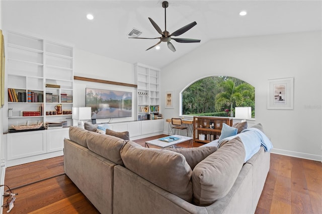 living area with a ceiling fan, vaulted ceiling, recessed lighting, visible vents, and dark wood-type flooring