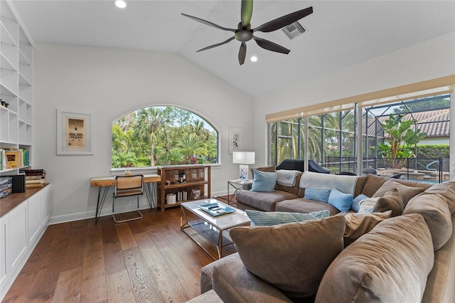 living area featuring visible vents, vaulted ceiling, ceiling fan, dark wood-style flooring, and baseboards
