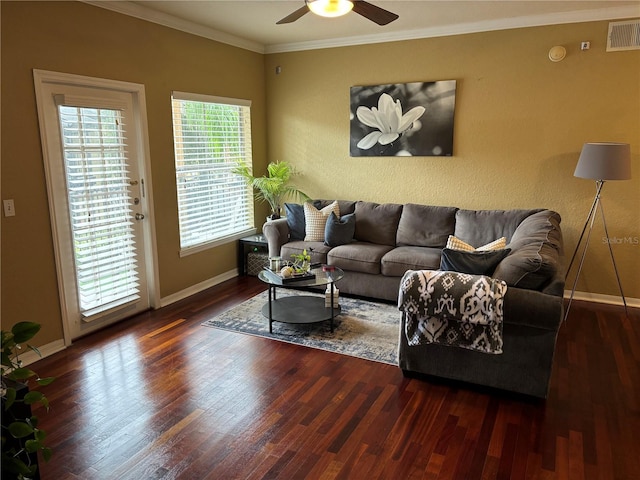 living room with visible vents, crown molding, ceiling fan, and wood finished floors