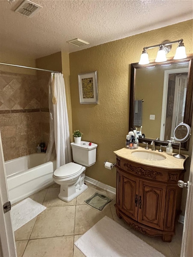 bathroom featuring visible vents, toilet, a textured wall, tile patterned floors, and a textured ceiling