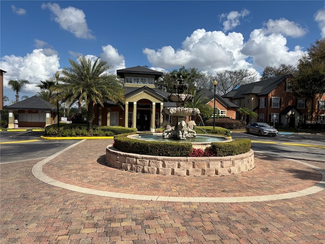 view of front of home featuring a residential view and uncovered parking