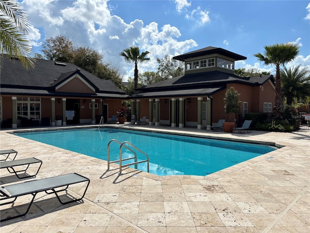 community pool with a patio