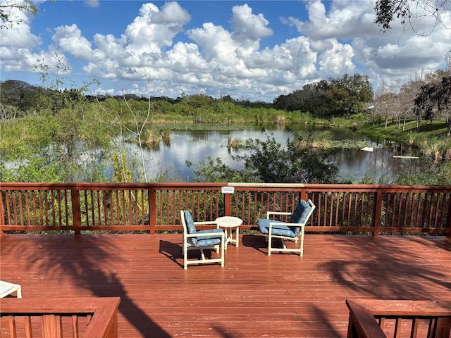 wooden terrace with a water view