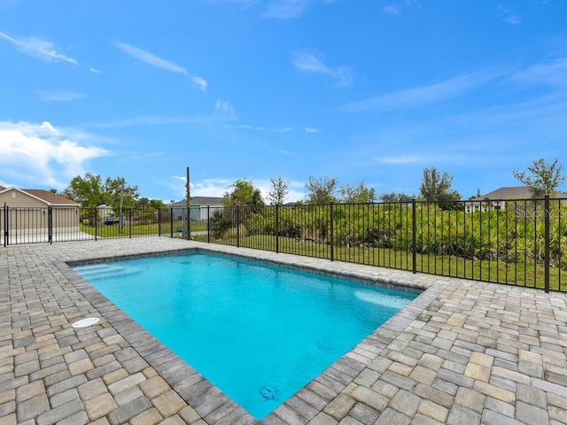 view of pool featuring a patio area, a fenced in pool, and fence