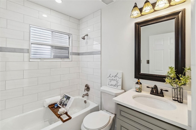bathroom with vanity, toilet, bathing tub / shower combination, and visible vents