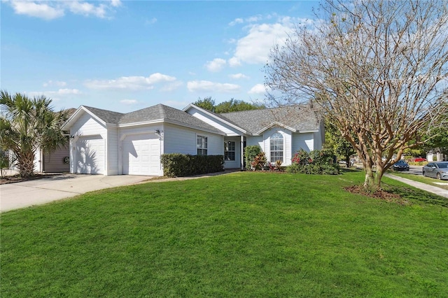 single story home featuring concrete driveway, an attached garage, and a front yard