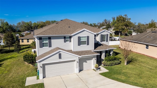 traditional-style house with an attached garage, a front lawn, driveway, and roof with shingles