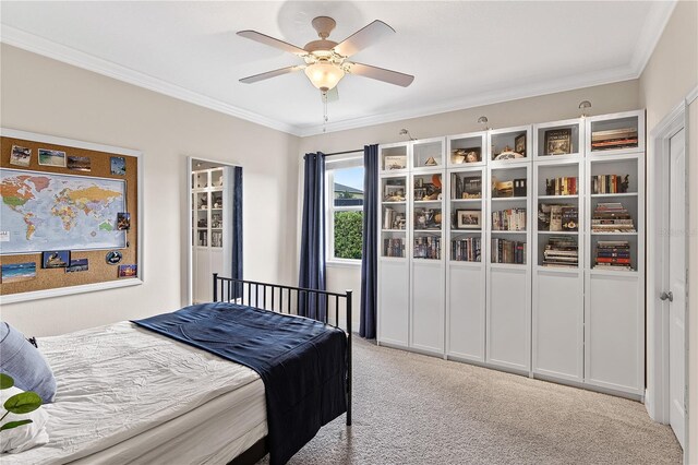 bedroom featuring light carpet, a ceiling fan, and ornamental molding