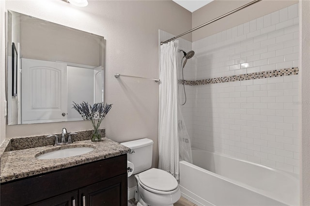 full bath featuring vanity, toilet, and shower / tub combo with curtain