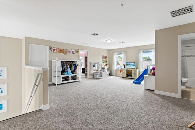 playroom with visible vents, baseboards, and carpet