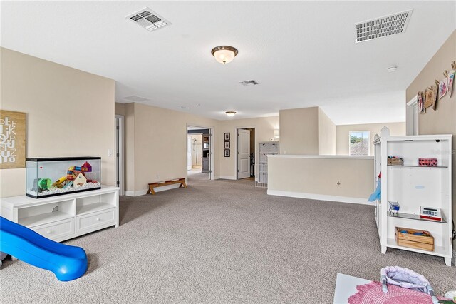 game room with visible vents, carpet floors, and baseboards