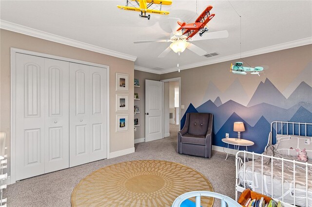 carpeted bedroom featuring a closet, visible vents, baseboards, and ornamental molding