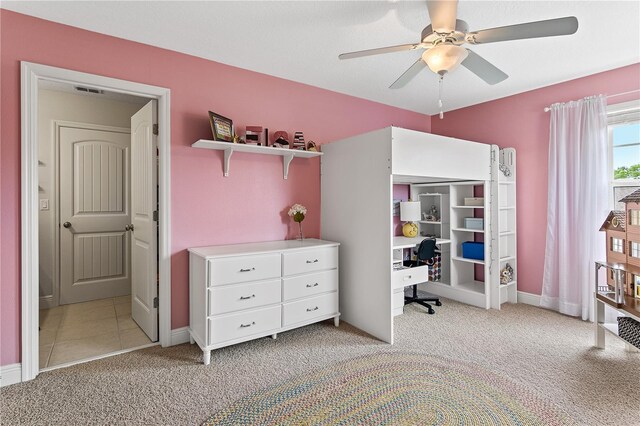 bedroom featuring baseboards, light carpet, visible vents, and ceiling fan