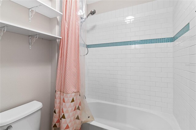 full bathroom with toilet and shower / tub combo
