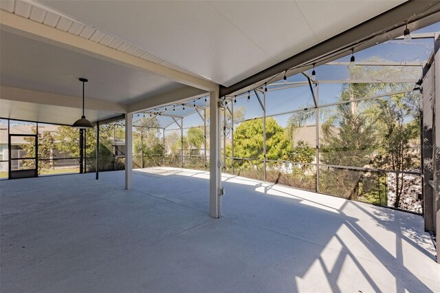 view of patio / terrace featuring glass enclosure