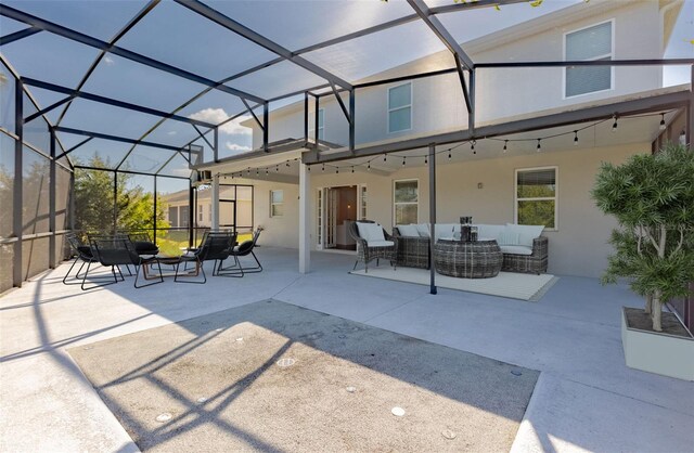 view of patio / terrace with an outdoor living space and a lanai