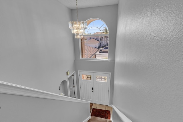 122 Carmel Bay Dr, Sanford, FL 32771 - foyer entrance featuring a notable chandelier and a textured wall