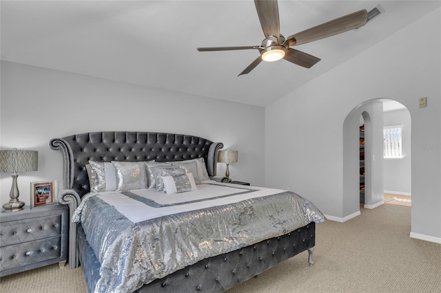 122 Carmel Bay Dr, Sanford, FL 32771 - bedroom with ceiling fan, baseboards, vaulted ceiling, carpet floors, and arched walkways