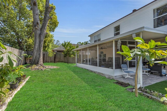 122 Carmel Bay Dr, Sanford, FL 32771 - view of yard featuring a fenced backyard, a patio, and a sunroom