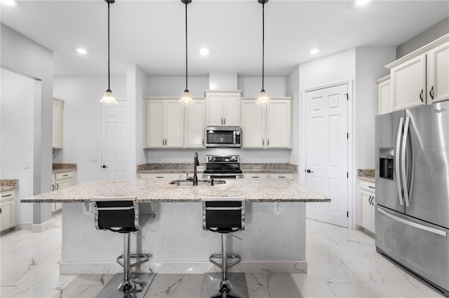 kitchen featuring a center island with sink, marble finish floor, stainless steel appliances, and a sink