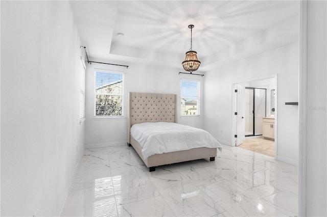 bedroom featuring a raised ceiling, multiple windows, and baseboards