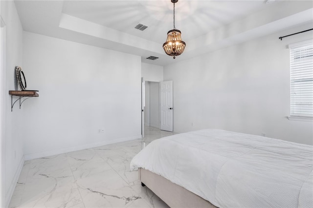 bedroom with visible vents, a raised ceiling, a notable chandelier, and baseboards
