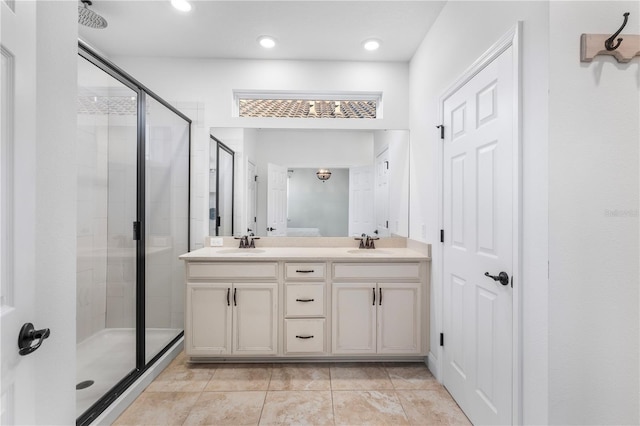 full bathroom with a shower stall, recessed lighting, double vanity, and a sink
