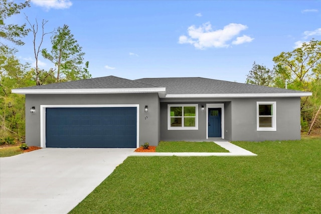 23 Fisher Run, Ocklawaha, FL 32179 - view of front of home featuring driveway, roof with shingles, a garage, a front lawn, and stucco siding