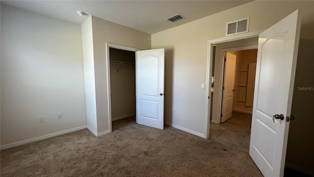 2597 Shamrock St, Tavares, FL 32778 - unfurnished bedroom featuring visible vents, carpet floors, baseboards, and a closet