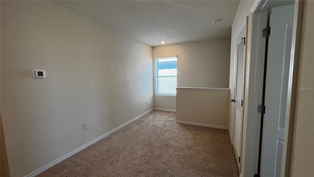 2597 Shamrock St, Tavares, FL 32778 - spare room featuring baseboards and light carpet
