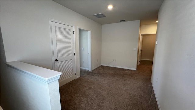 2597 Shamrock St, Tavares, FL 32778 - hallway with visible vents, carpet floors, baseboards, and an upstairs landing