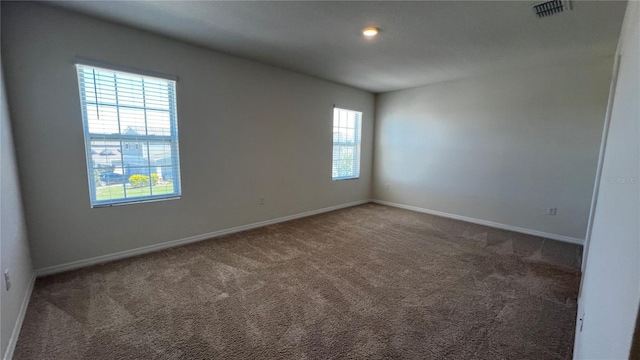 2597 Shamrock St, Tavares, FL 32778 - unfurnished room featuring carpet flooring, baseboards, and visible vents