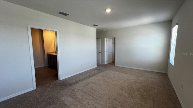 2597 Shamrock St, Tavares, FL 32778 - unfurnished bedroom featuring visible vents, baseboards, and carpet flooring