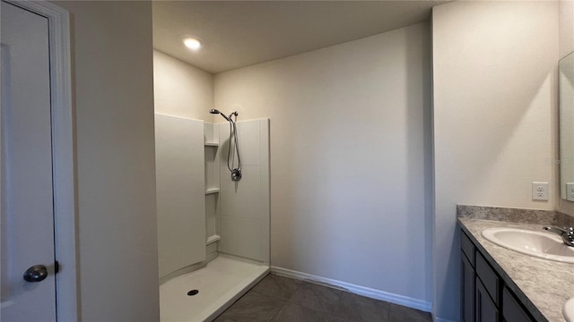 2597 Shamrock St, Tavares, FL 32778 - full bath with vanity, tile patterned floors, baseboards, and a stall shower