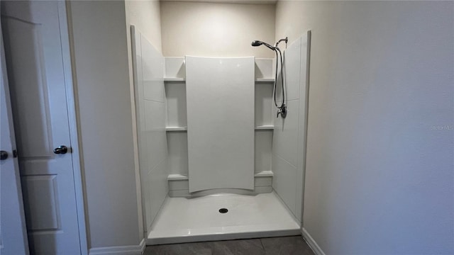 2597 Shamrock St, Tavares, FL 32778 - bathroom with baseboards and a stall shower