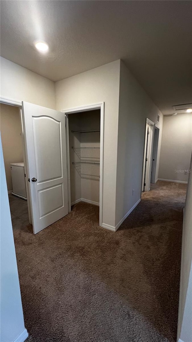 2597 Shamrock St, Tavares, FL 32778 - unfurnished bedroom with a closet, baseboards, and carpet