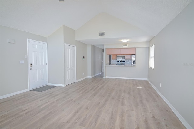 unfurnished living room featuring light wood-type flooring, baseboards, high vaulted ceiling, and visible vents