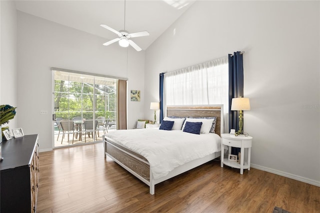 551 Wheatstone Pl, Orlando, FL 32835 - bedroom featuring baseboards, a ceiling fan, access to exterior, high vaulted ceiling, and wood finished floors