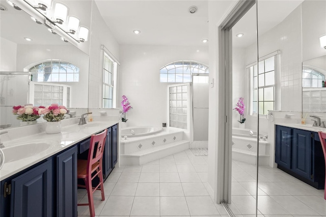 551 Wheatstone Pl, Orlando, FL 32835 - full bath with a sink, a bath, and tile patterned flooring