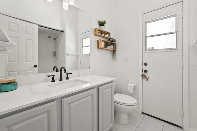 551 Wheatstone Pl, Orlando, FL 32835 - bathroom with toilet, vanity, tile patterned flooring, and a shower